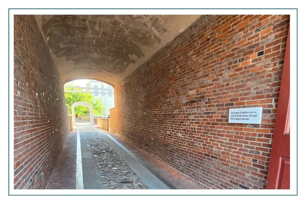 The archway that Benjamin Franklin built to provide access to his print shop and home that once stood here in Philadelphia.