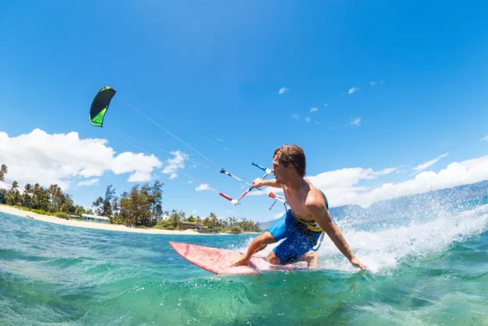 A man kiteboarding on the ocean