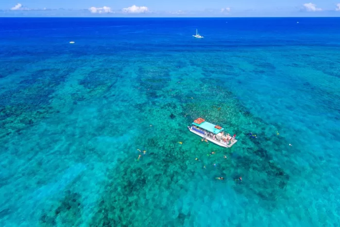 Aerial view of a charter boat and snorkelers in Turks and Caicos