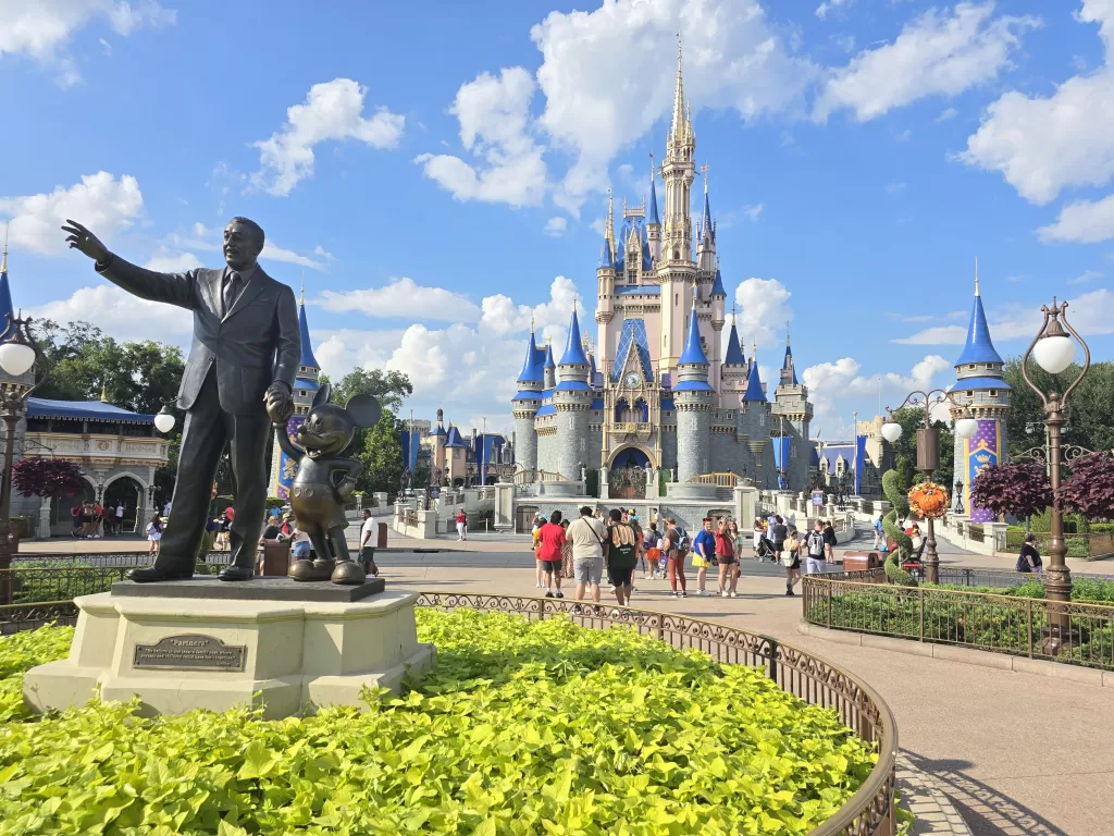 Statue of Walt Disney and Mickey Mouse in front of Cinderella's Castle at Walt Disney World in Orlando, Florida