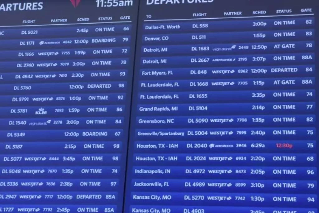 A flight departure board at LaGuardia Airport in NYC