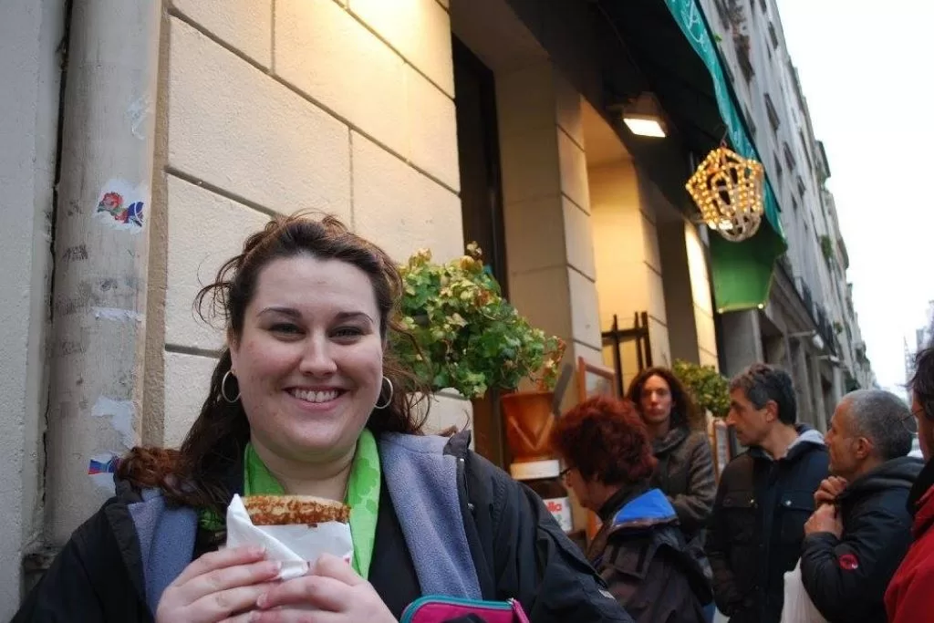 Sarah enjoying a fresh crepe in Paris Sarah enjoying a fresh crepe in Paris